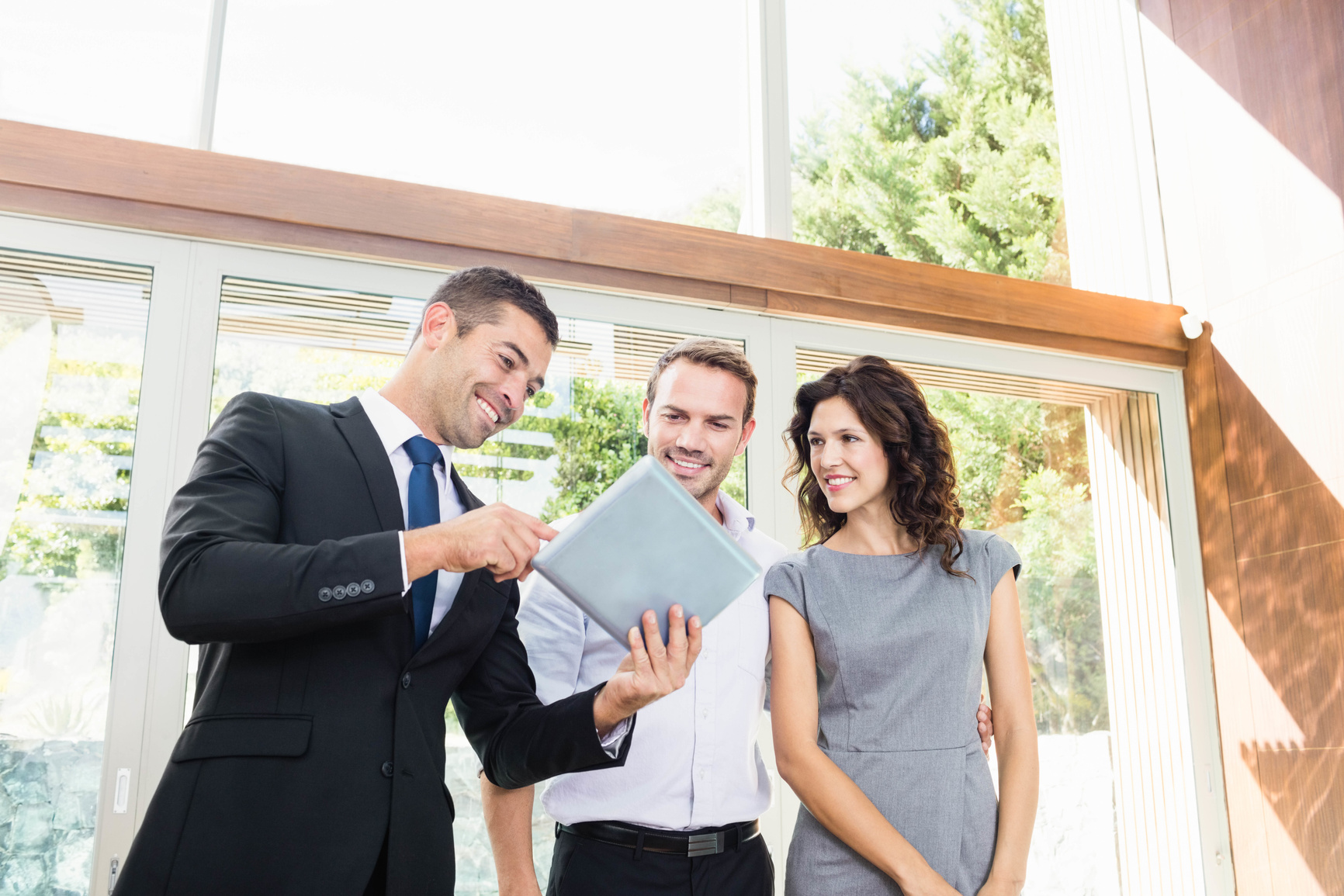 Real-estate agent showing couple new home